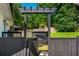 The private backyard features a deck, mature trees, and a stylish pergola at 941 Shirley Se St, Smyrna, GA 30082