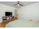 Bright bedroom features ceiling fan, hardwood floors and a television on the storage unit at 941 Shirley Se St, Smyrna, GA 30082