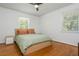 Serene bedroom with hardwood floors, large windows, and a neutral color palette at 941 Shirley Se St, Smyrna, GA 30082