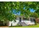 Stylish single-story home featuring painted brick, dark trim and well-manicured landscaping at 941 Shirley Se St, Smyrna, GA 30082