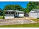 This attractive house has mature trees, a detached garage and manicured landscaping at 941 Shirley Se St, Smyrna, GA 30082