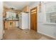 Cozy kitchen with light wood cabinets, tile flooring, and a bright window with natural light at 941 Shirley Se St, Smyrna, GA 30082
