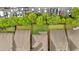 Aerial view showcasing backyard space with green lawn, adjacent to parking and rooftops at 12 Pine St, Roswell, GA 30075