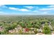 Wide aerial view of the community surrounded by lush green trees under a blue sky at 12 Pine St, Roswell, GA 30075