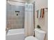 Bathroom featuring tiled shower with niche, bathtub, and toilet at 12 Pine St, Roswell, GA 30075