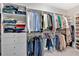 Spacious walk-in closet providing ample storage, with built-in shelving and drawers at 12 Pine St, Roswell, GA 30075
