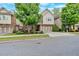 Charming two-story home featuring brick and siding, a well-manicured lawn, and an attached two-car garage at 12 Pine St, Roswell, GA 30075