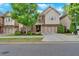 Charming two-story home featuring a brick facade, attached two-car garage, and manicured landscaping at 12 Pine St, Roswell, GA 30075