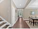 Entryway featuring a staircase, hardwood floors, and a dining table at 12 Pine St, Roswell, GA 30075