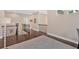 Upstairs hallway with hardwood floors and natural light at 12 Pine St, Roswell, GA 30075