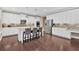 Spacious kitchen with a large island, stainless steel appliances, and white cabinetry at 12 Pine St, Roswell, GA 30075