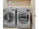 Bright laundry room featuring a modern washer and dryer at 12 Pine St, Roswell, GA 30075