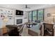 Comfortable living room with built-in bookshelves, a fireplace, ample seating, and plenty of natural light at 12 Pine St, Roswell, GA 30075