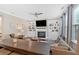 Comfortable living room with built-in bookshelves, a fireplace, ample seating, and plenty of natural light at 12 Pine St, Roswell, GA 30075