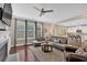 Open-concept living room boasts a fireplace, large windows, and hardwood flooring at 12 Pine St, Roswell, GA 30075