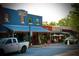 Exterior of Lola's Burger & Tequila Bar, featuring outdoor seating and a lively street scene at 12 Pine St, Roswell, GA 30075