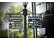 Navigational street sign indicating directions to Chattahoochee Nature Center and Barrington Hall at 12 Pine St, Roswell, GA 30075