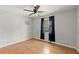 This bedroom has natural light, wood floors, and a ceiling fan at 230 Oakridge Se Dr, Cartersville, GA 30121
