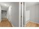 This hallway has wood floors and access to the full bathroom at 230 Oakridge Se Dr, Cartersville, GA 30121