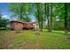 Beautiful backyard with a wooden deck, mature trees, and lush greenery, providing a serene outdoor space at 3047 Hudson Ct, Decatur, GA 30033