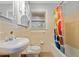 Cozy bathroom features a vanity with a white sink, cabinet storage, and a window bringing in natural light at 3047 Hudson Ct, Decatur, GA 30033