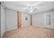 A well lit bedroom featuring a ceiling fan and two brick column accents at 3047 Hudson Ct, Decatur, GA 30033