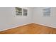 Well-lit bedroom with hardwood floors, white trim, and large windows at 3047 Hudson Ct, Decatur, GA 30033
