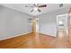 Bedroom featuring hardwood floors and access to bathroom with bright lighting at 3047 Hudson Ct, Decatur, GA 30033