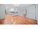 Open dining area with hardwood floors and a view into the kitchen at 3047 Hudson Ct, Decatur, GA 30033