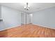 Inviting dining room with hardwood floors and a modern chandelier fixture at 3047 Hudson Ct, Decatur, GA 30033