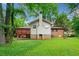 Charming house exterior with a deck and landscaped backyard, perfect for outdoor entertaining and enjoying nature at 3047 Hudson Ct, Decatur, GA 30033