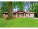 Charming brick home with a well-manicured front yard and mature shade trees at 3047 Hudson Ct, Decatur, GA 30033