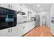 Updated kitchen featuring white cabinets, stainless steel appliances, and granite counters at 3047 Hudson Ct, Decatur, GA 30033