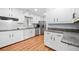 Well-lit kitchen featuring white cabinets and stainless-steel appliances at 3047 Hudson Ct, Decatur, GA 30033
