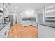 Charming kitchen with modern appliances, gray countertops and hardwood floors at 3047 Hudson Ct, Decatur, GA 30033