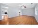 Spacious living area with natural light, hardwood floors, and views of the fireplace and kitchen at 3047 Hudson Ct, Decatur, GA 30033