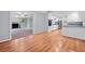 Spacious living space with hardwood floors transitions into the kitchen at 3047 Hudson Ct, Decatur, GA 30033
