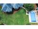 Backyard aerial view with swimming pool and a lush, green lawn at 3140 Thoreau Ct, Loganville, GA 30052