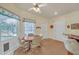 Bright breakfast nook featuring a round table with seating, windows, and a ceiling fan for a cozy dining experience at 3140 Thoreau Ct, Loganville, GA 30052