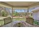 Relaxing covered deck shows an outdoor living space with a view of the beautifully landscaped backyard at 3140 Thoreau Ct, Loganville, GA 30052