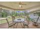 Relaxing covered deck with outdoor seating area and a serene backyard view, perfect for entertaining at 3140 Thoreau Ct, Loganville, GA 30052