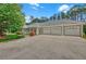 Spacious three-car garage with ample parking on a large concrete driveway at 3140 Thoreau Ct, Loganville, GA 30052