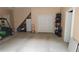 A large garage providing ample storage and parking space, with a golf cart at 3140 Thoreau Ct, Loganville, GA 30052