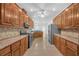 Open kitchen showcasing stainless steel appliances, updated countertops, and ample storage space at 3140 Thoreau Ct, Loganville, GA 30052