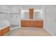 A main bathroom with a glass shower, double sink vanity, and carpeted floors at 3140 Thoreau Ct, Loganville, GA 30052