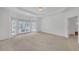 A large main bedroom with neutral carpet, lots of natural light, and a tray ceiling at 3140 Thoreau Ct, Loganville, GA 30052