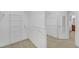 A walk-in closet featuring wire shelving and access to the main bathroom at 3140 Thoreau Ct, Loganville, GA 30052
