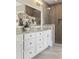Bathroom featuring white cabinets with granite counters and tiled walk-in shower with glass door at 3834 Chamblee Dunwoody Rd, Atlanta, GA 30341