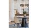 Dining area with modern chandelier, custom furnishings, and large windows at 3834 Chamblee Dunwoody Rd, Atlanta, GA 30341