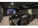 Home theater room with comfortable leather recliner seating and a large screen for an immersive viewing experience at 3834 Chamblee Dunwoody Rd, Atlanta, GA 30341